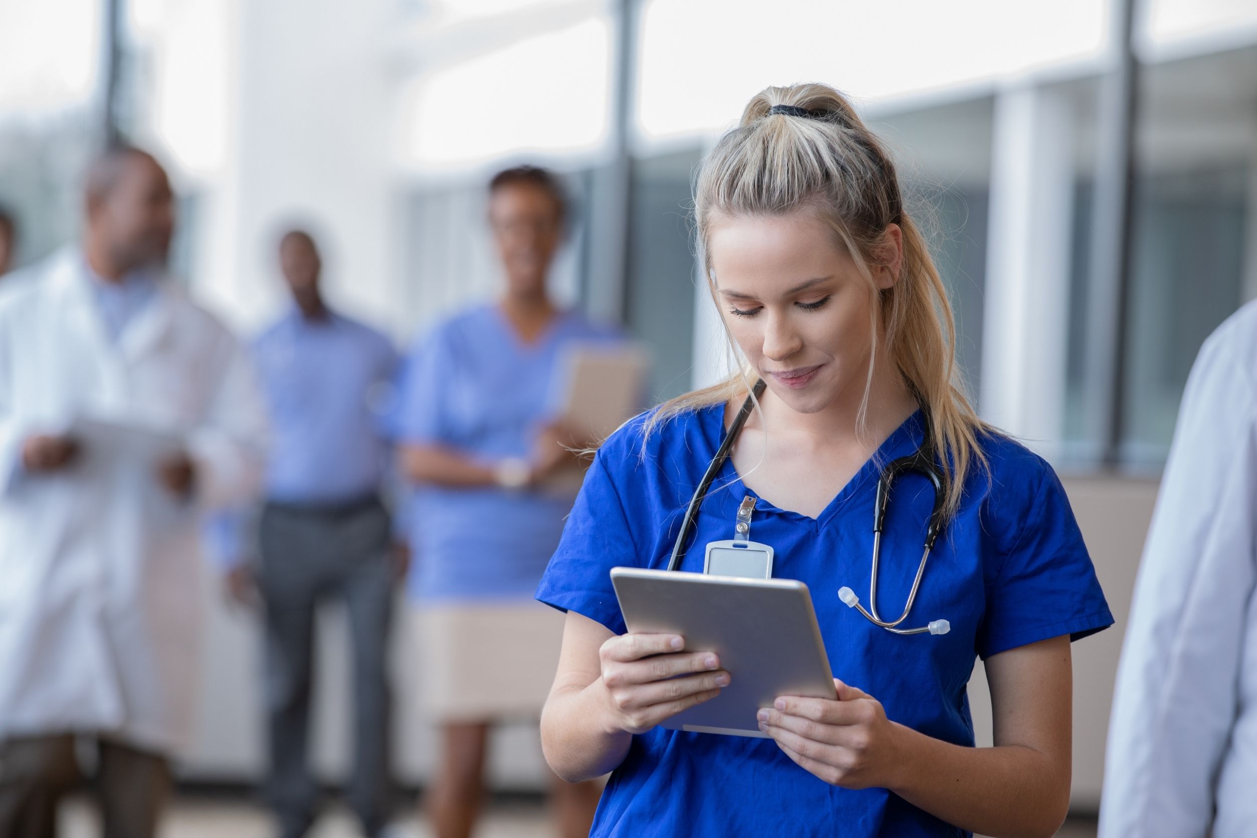 LPN studying for the NCLEX-PN with a tablet