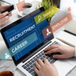 A person types of a laptop, demonstrating recruiting for healthcare positions in Western PA.